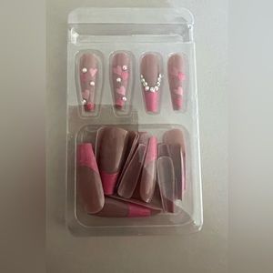 Pink heart and rhinestone press on nails.